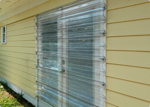 Aluminum and clear Lexan storm panels installed by Affordable Glass Protection in Brevard County, Florida