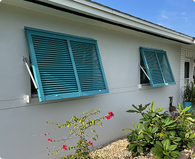 Bahama shutters installed on a coastal home in Brevard County, FL – stylish hurricane protection with shade and storm security from Affordable Glass Protection.