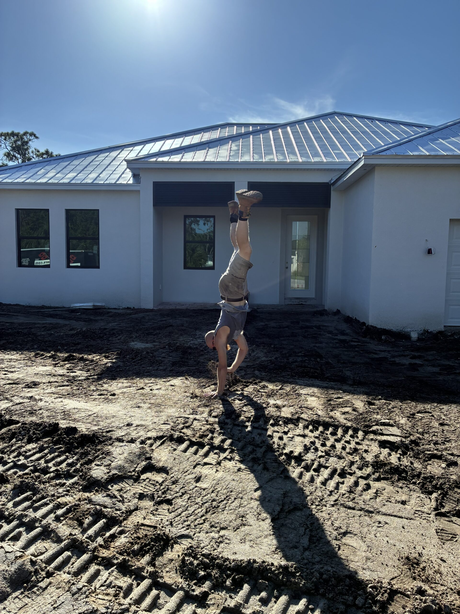 New construction home with Bahama hurricane shutters installed by Affordable Glass Protection in Brevard County Florida