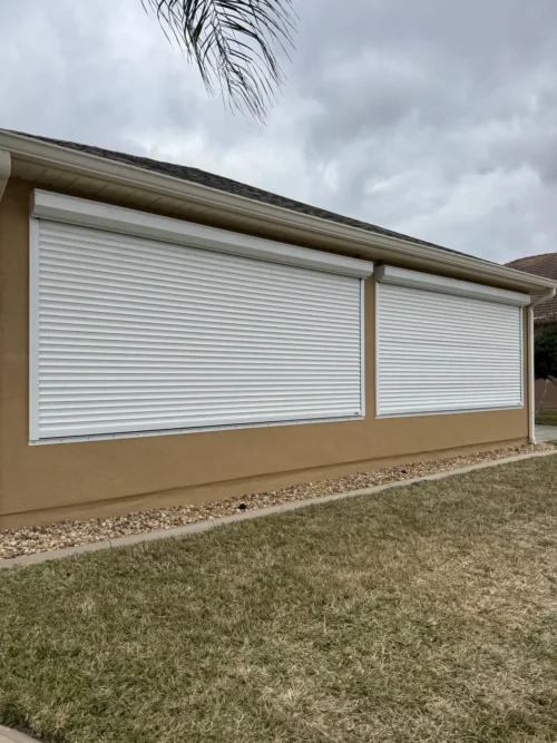 Roll-down metal hurricane shutters fitted by Affordable Glass Protection on the Space Coast of Florida