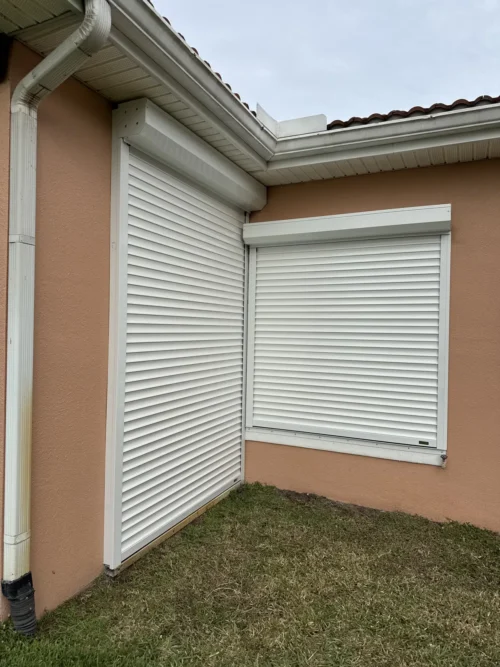 Roll-down metal hurricane shutters installed by Affordable Glass Protection in Brevard County, Florida