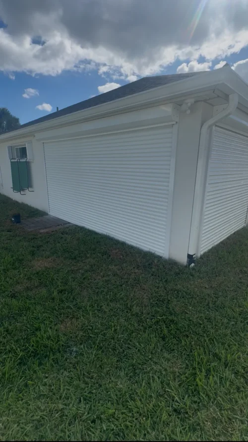 Roll-down metal hurricane shutters fitted by Affordable Glass Protection on the Space Coast of Florida