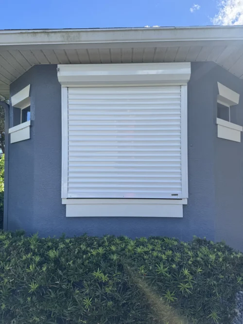 Roll-down metal hurricane shutters fitted by Affordable Glass Protection on the Space Coast of Florida